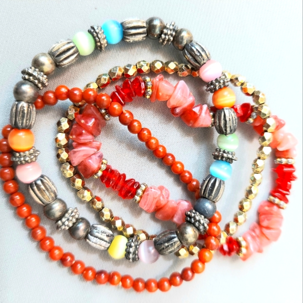 Set of 4 Pc stretchy beaded bracelets. Beautiful colors and beads. Preowned EC